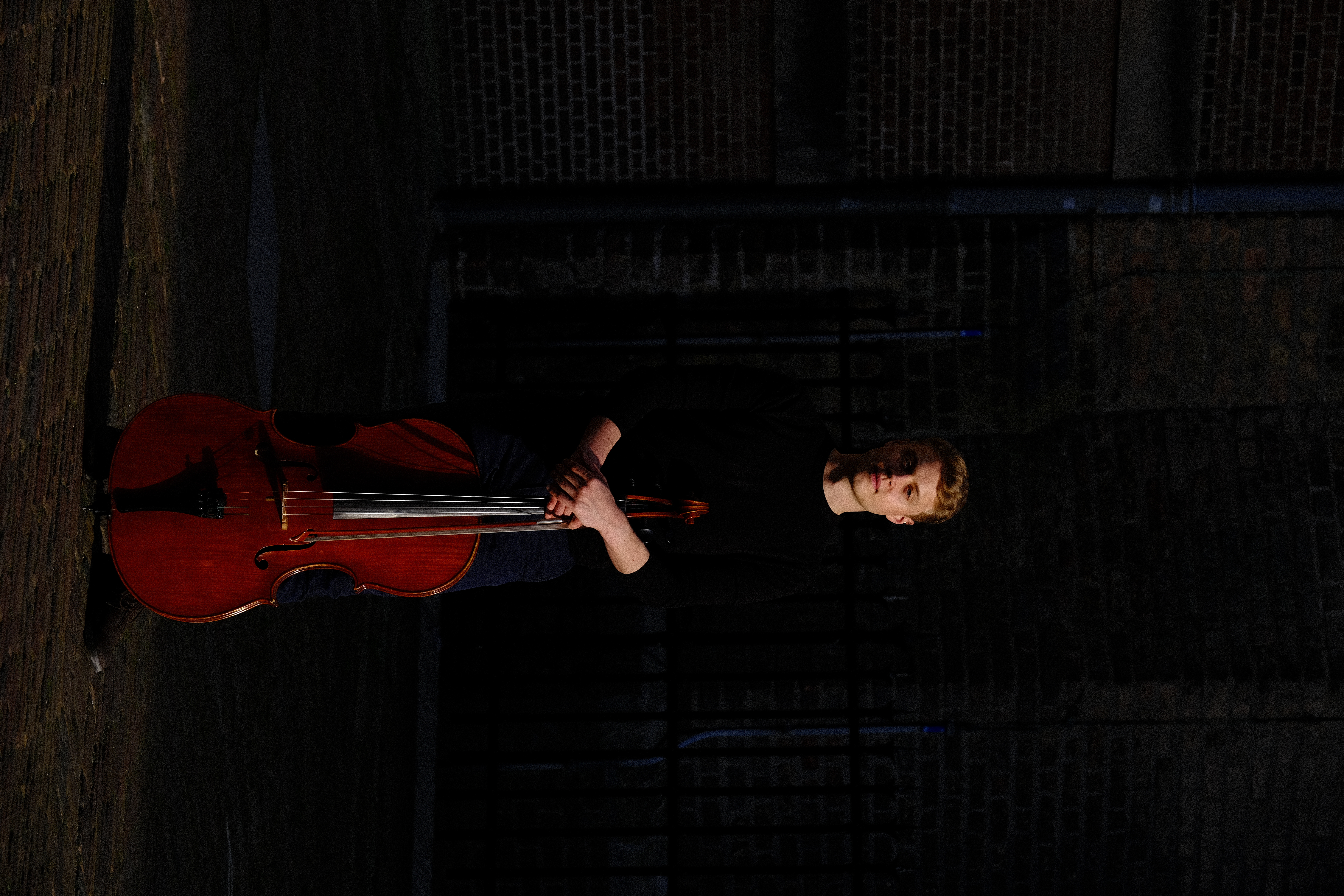 Cellist Luka Stefanović portrait with cello, The Hague 2023
